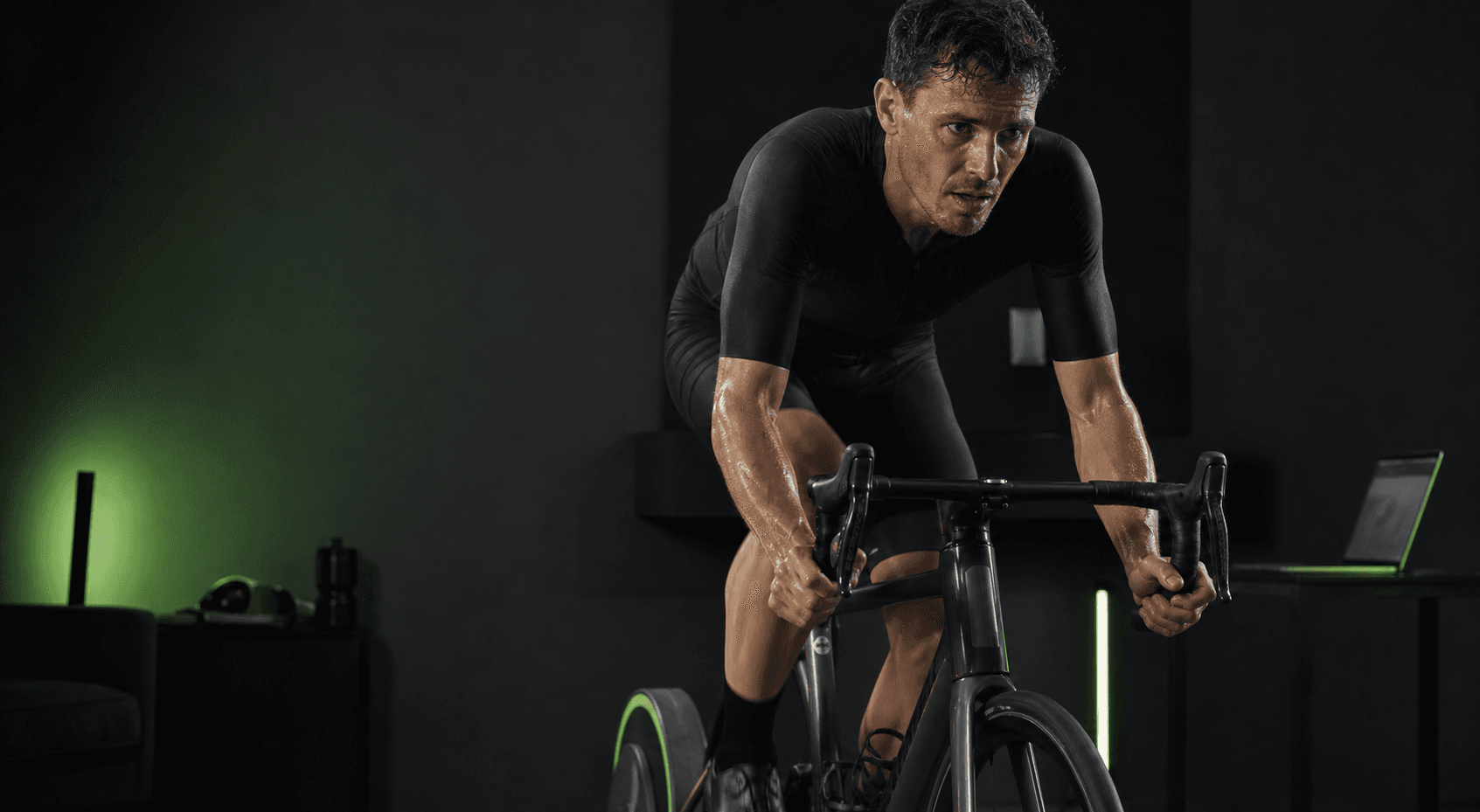 Cyclist riding hard on an indoor trainer