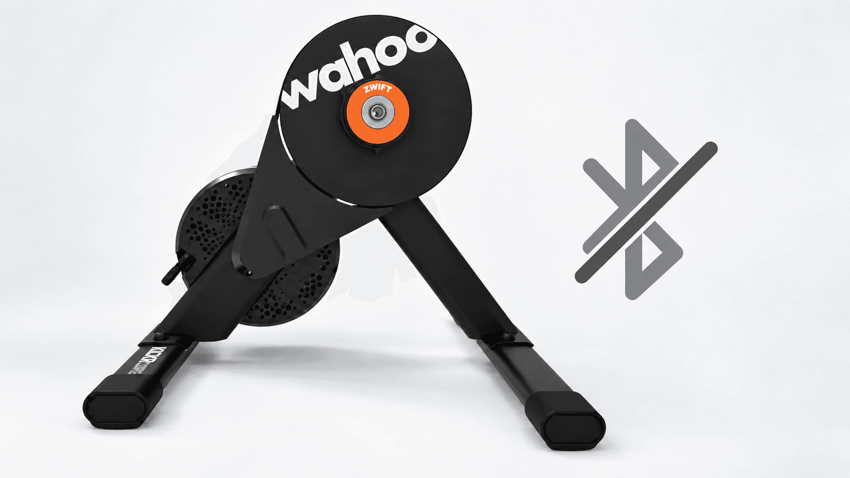 Wahoo KICKR CORE trainer beside a grey crossed-out Bluetooth symbol